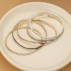5-delige set: vergulde en verzilverd armbanden met edelstenen
