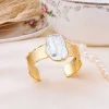 Vergulde ring met parelmoer